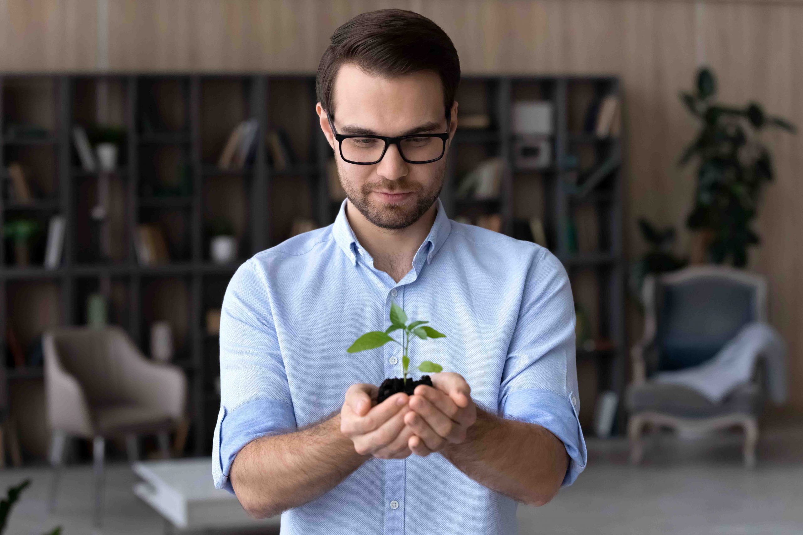 Man holding small plant